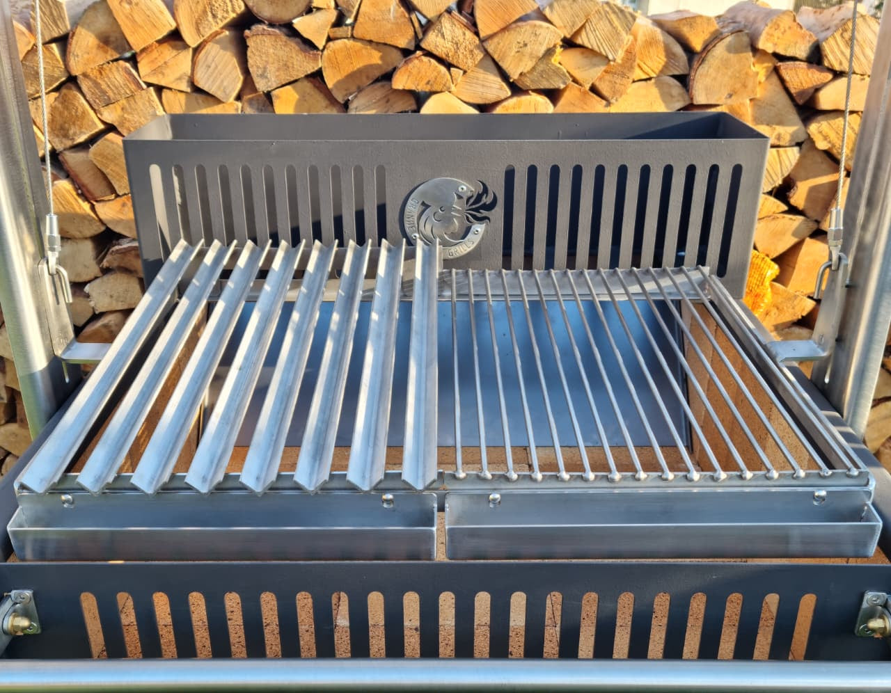 Argentinian grill with a V-grate and grill combo in front of stacked firewood