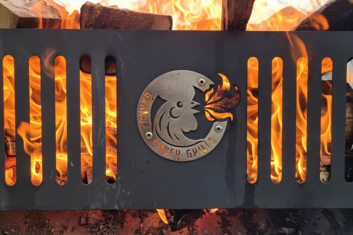 Brasero with a rooster logo and 'Grande Ember Grills' text against flames